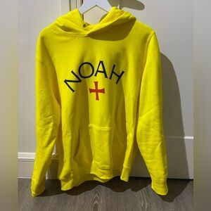Noah NYC Yellow Hoodie with Black Logo and Red Cross